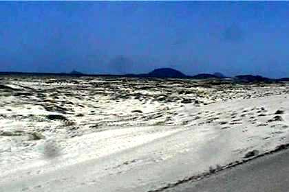 Blue skies, black mountains, white sand - Danakil Desert.